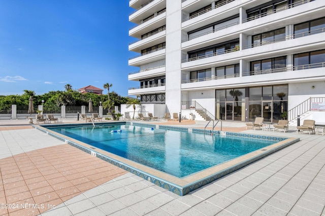 view of pool featuring a patio area