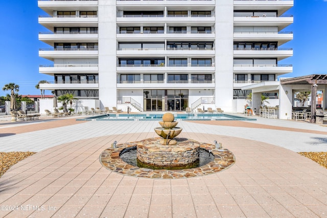 view of property featuring a community pool