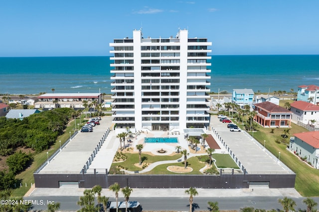 exterior space featuring a water view and central AC