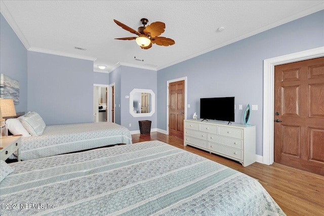 bedroom featuring ceiling fan, a textured ceiling, ornamental molding, and light hardwood / wood-style flooring