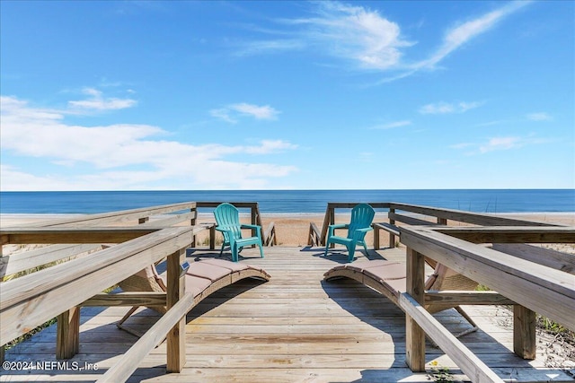 exterior space with a beach view and a water view