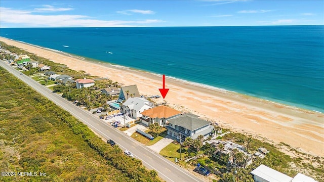 bird's eye view with a view of the beach and a water view