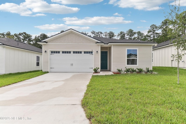 ranch-style home featuring a garage and a front lawn