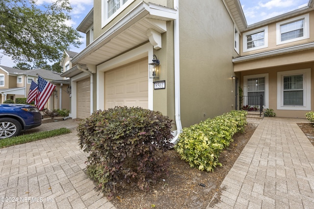 view of side of home featuring a garage