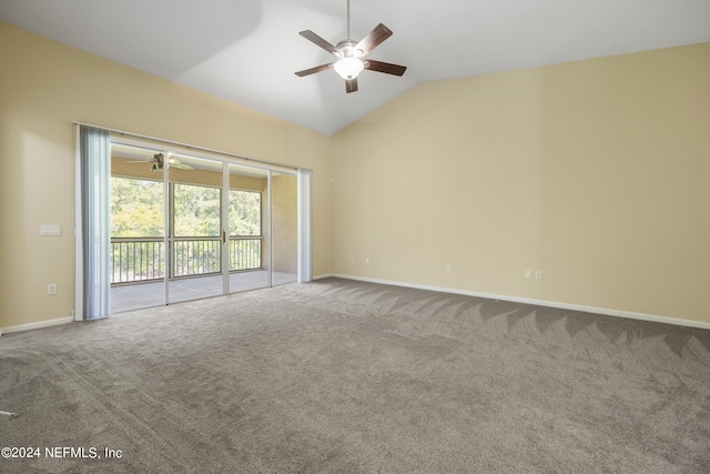 carpeted empty room featuring lofted ceiling and ceiling fan