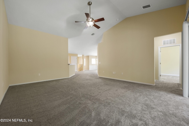 carpeted spare room featuring high vaulted ceiling and ceiling fan