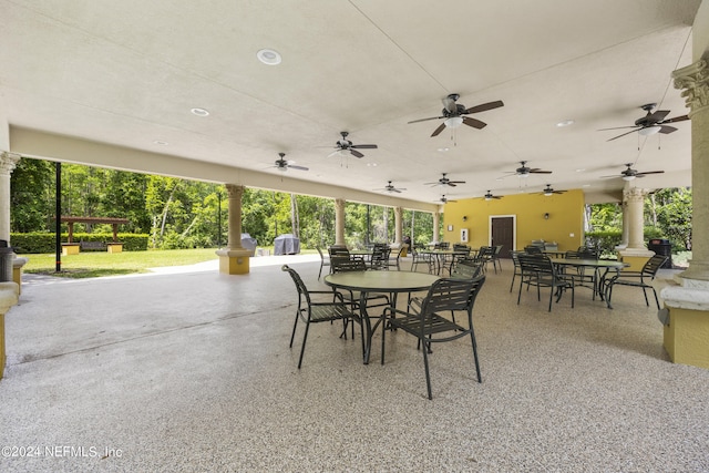 view of terrace with a grill and ceiling fan