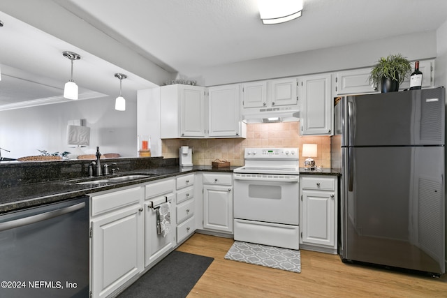 kitchen with white cabinetry, hanging light fixtures, light hardwood / wood-style flooring, appliances with stainless steel finishes, and sink