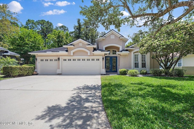 view of front facade featuring a front yard and a garage