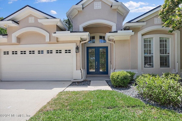 view of front of home featuring a garage and french doors