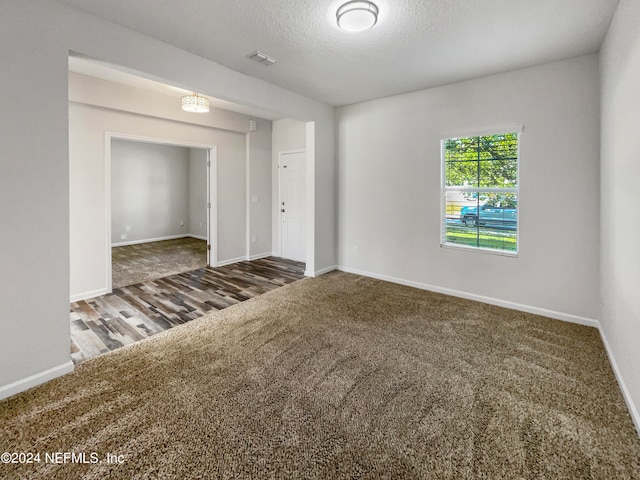 spare room featuring hardwood / wood-style flooring