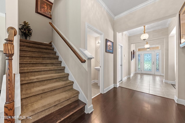 tiled entryway with crown molding