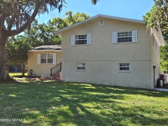 exterior space featuring a lawn