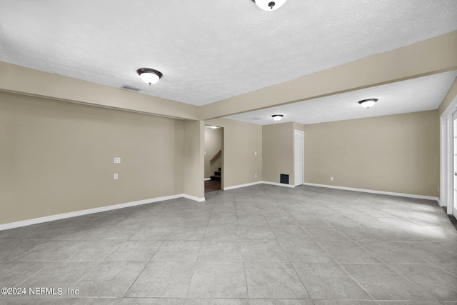 basement with a textured ceiling