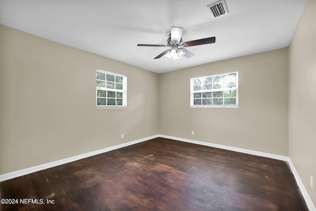 unfurnished room with dark hardwood / wood-style floors