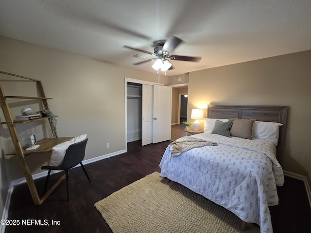 bedroom with ceiling fan, a closet, and dark wood-type flooring