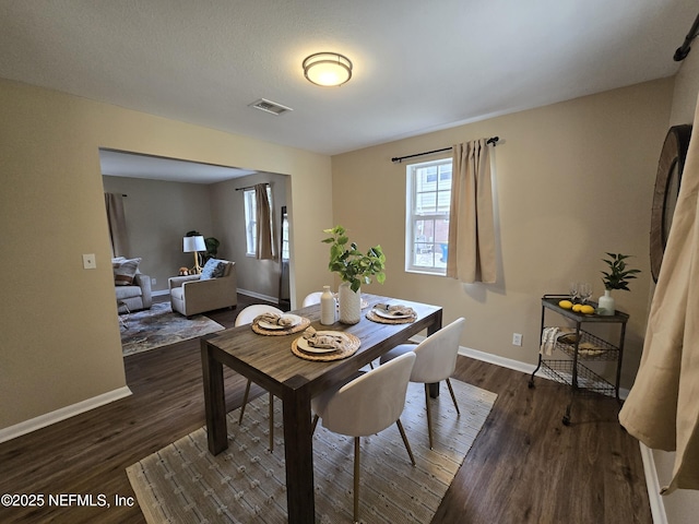 dining room featuring dark hardwood / wood-style floors