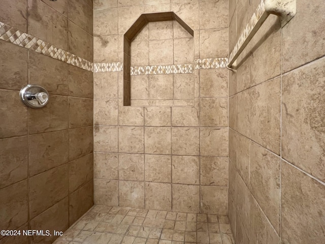 bathroom with tiled shower