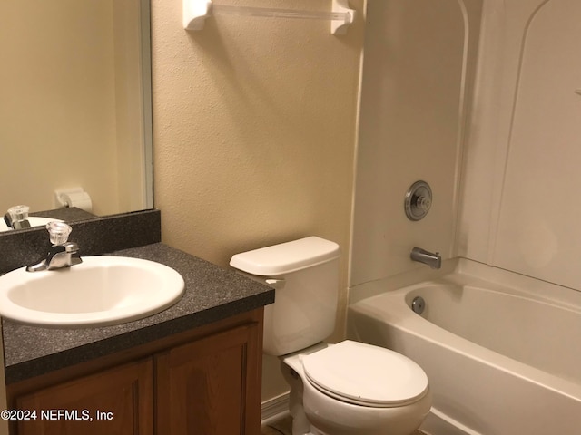 full bathroom with shower / tub combination, vanity, and toilet