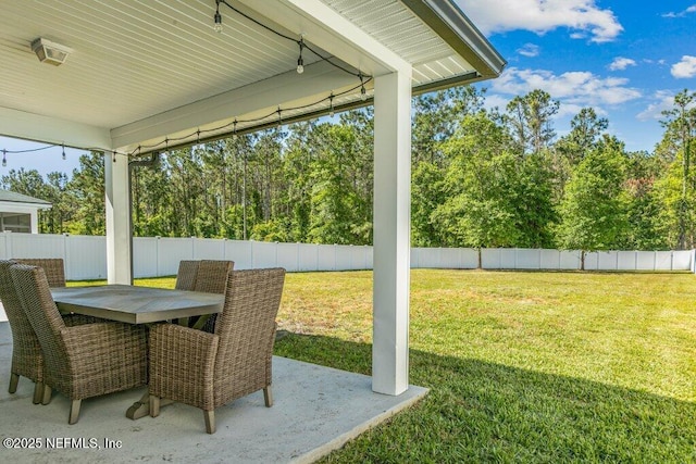 sunroom featuring outdoor dining area