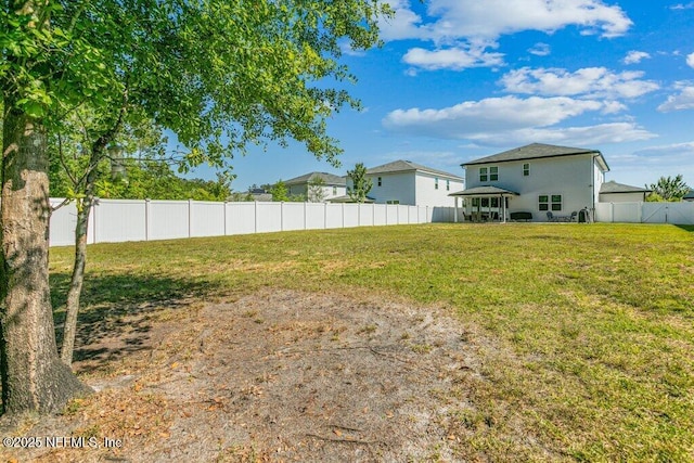 view of yard with a fenced backyard
