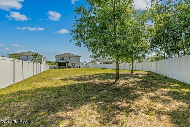view of yard featuring a fenced backyard