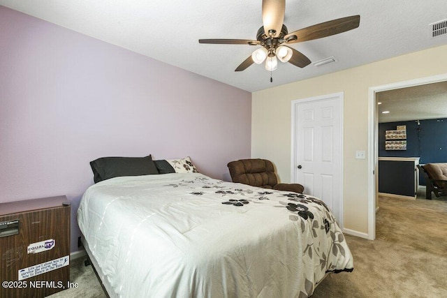bedroom with light carpet, baseboards, visible vents, and ceiling fan