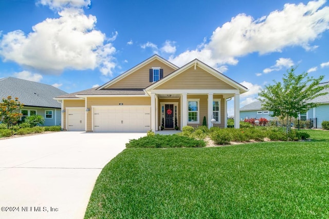 view of front facade with a garage and a front yard