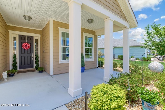 doorway to property featuring covered porch