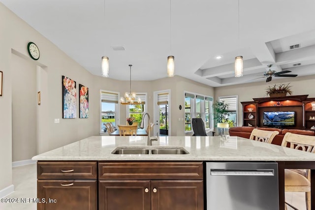 kitchen with coffered ceiling, decorative light fixtures, a wealth of natural light, and stainless steel dishwasher