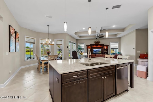 kitchen featuring stainless steel dishwasher, plenty of natural light, ceiling fan with notable chandelier, hanging light fixtures, and sink