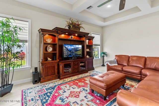 living room featuring coffered ceiling, ceiling fan, a wealth of natural light, and light tile floors