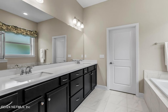 bathroom featuring tile flooring, tiled bath, and double sink vanity