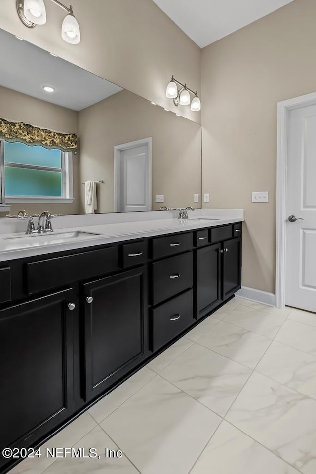 bathroom featuring tile floors and double sink vanity