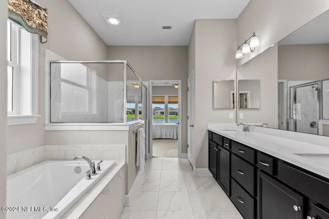 bathroom with tile floors, plus walk in shower, double sink, and large vanity