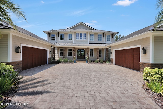 view of front of home featuring a garage and a porch