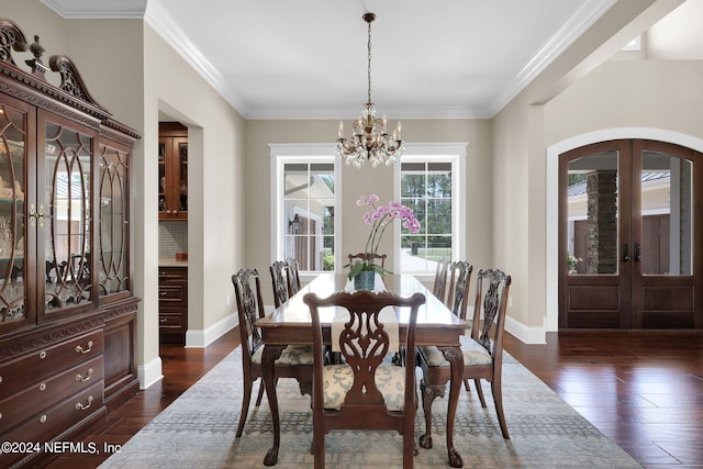 dining room with an inviting chandelier, dark hardwood / wood-style floors, plenty of natural light, and french doors