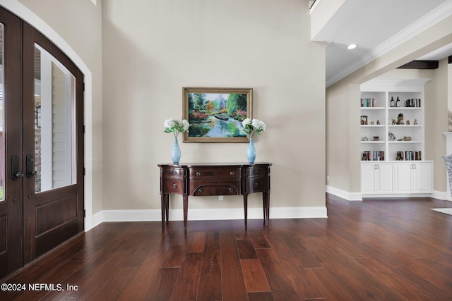 entryway with french doors, dark hardwood / wood-style floors, and crown molding