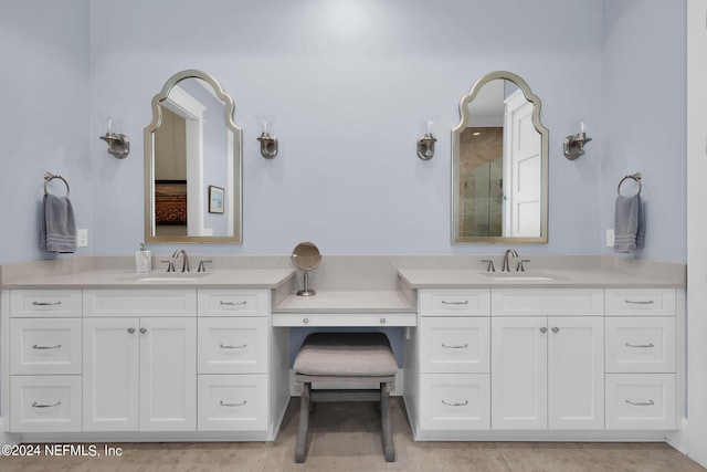 bathroom with vanity and an enclosed shower