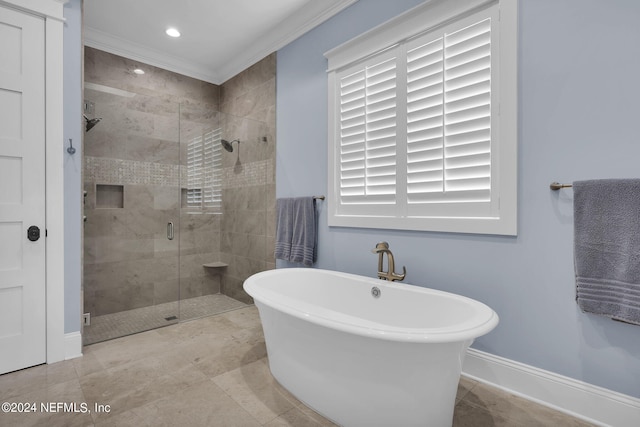 bathroom featuring crown molding and shower with separate bathtub