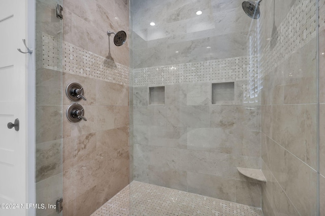 bathroom with tiled shower