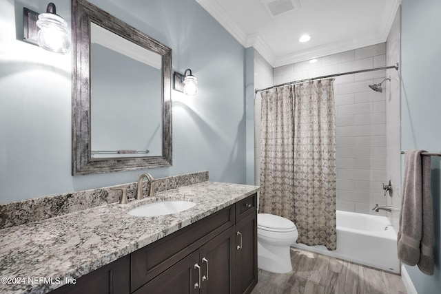 full bathroom featuring hardwood / wood-style floors, vanity, shower / bath combo, toilet, and crown molding