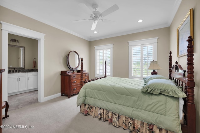 bedroom featuring ceiling fan, ornamental molding, connected bathroom, and light carpet