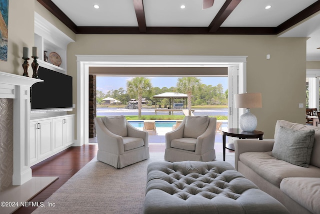 living room with beam ceiling and hardwood / wood-style floors