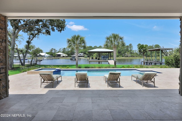 view of pool featuring a patio, a gazebo, a water view, and an in ground hot tub