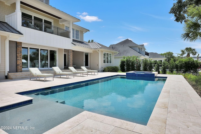 view of pool featuring an in ground hot tub and a patio area