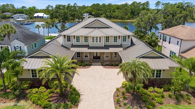 view of front of home with a water view and a porch