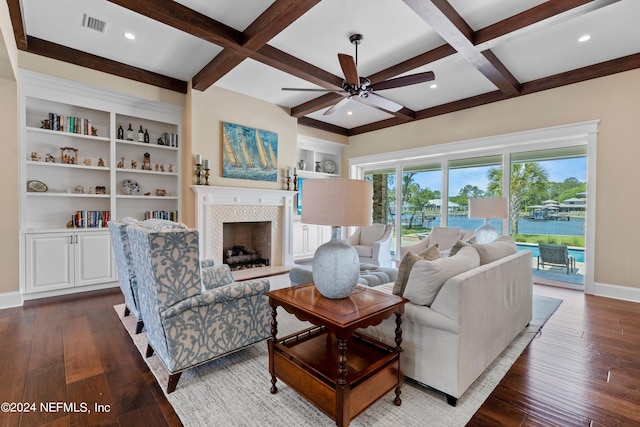 living room with beamed ceiling, coffered ceiling, and dark hardwood / wood-style flooring