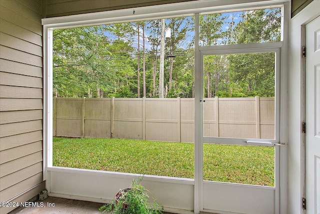 unfurnished sunroom with a wealth of natural light