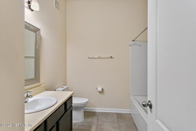 full bathroom featuring vanity, toilet, tile patterned floors, and bathing tub / shower combination